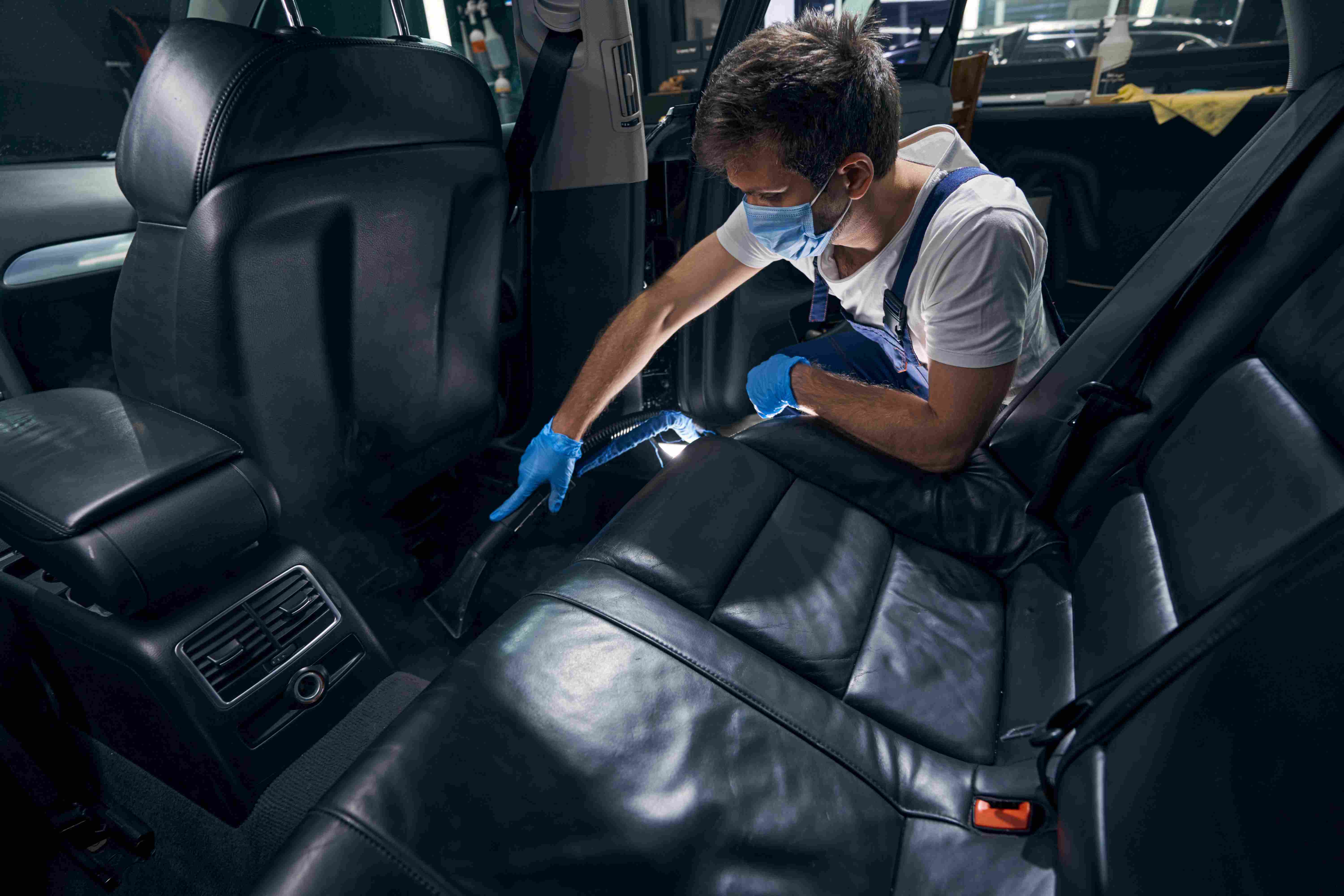 Man cleaning hybrid car